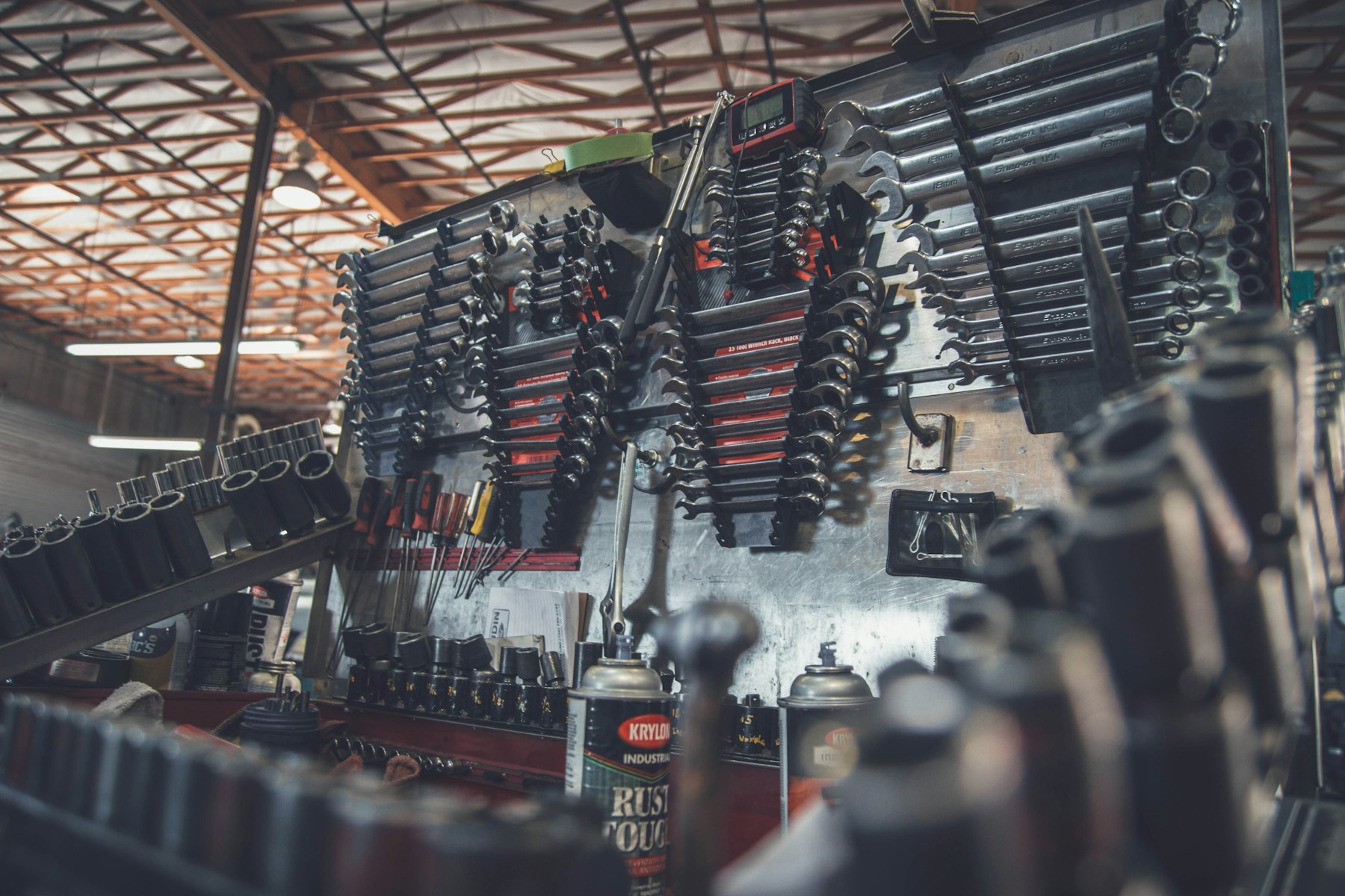 Workshop wall stocked with parts and testing equipment