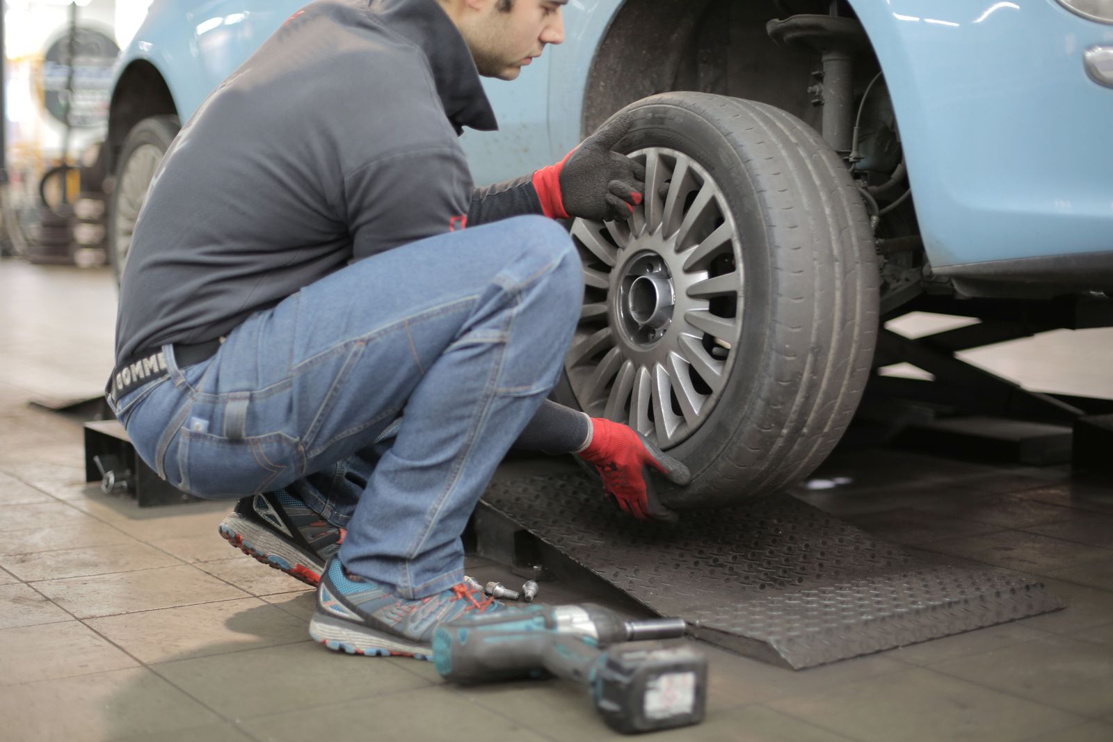 Technician carrying out wheel work in the workshop