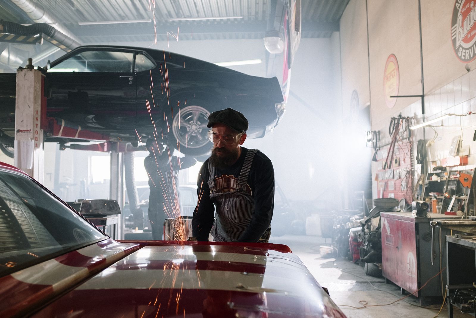 Mechanic working beneath a car in the workshop